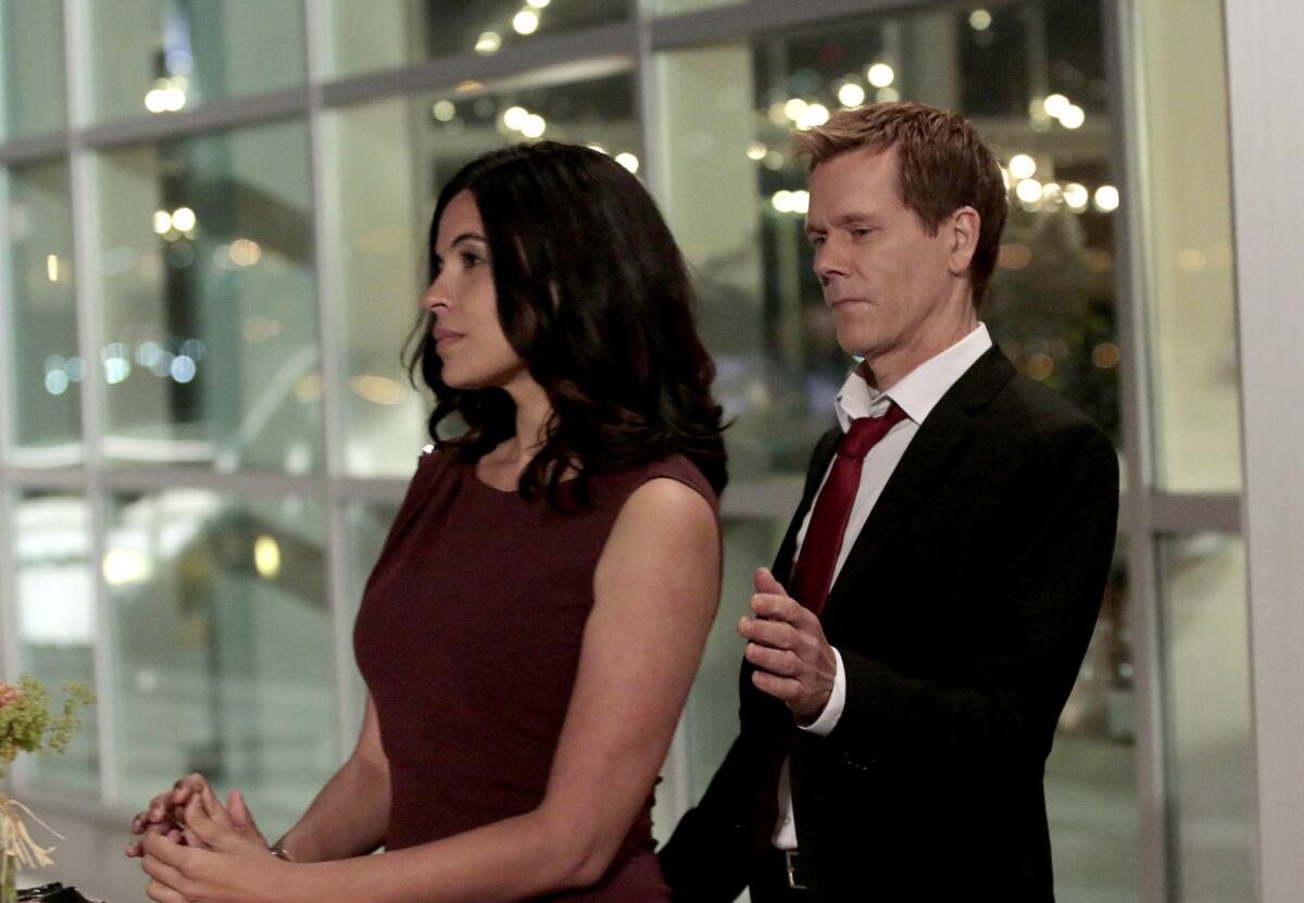 Zuleikha Robinson and Kevin Bacon in "The Following" on Fox.