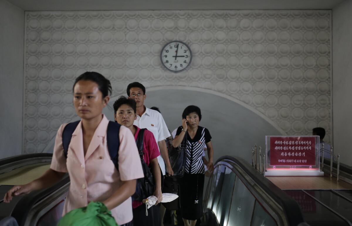 North Koreans leave an underground train station in Pyongyang on Sept. 1, 2014.