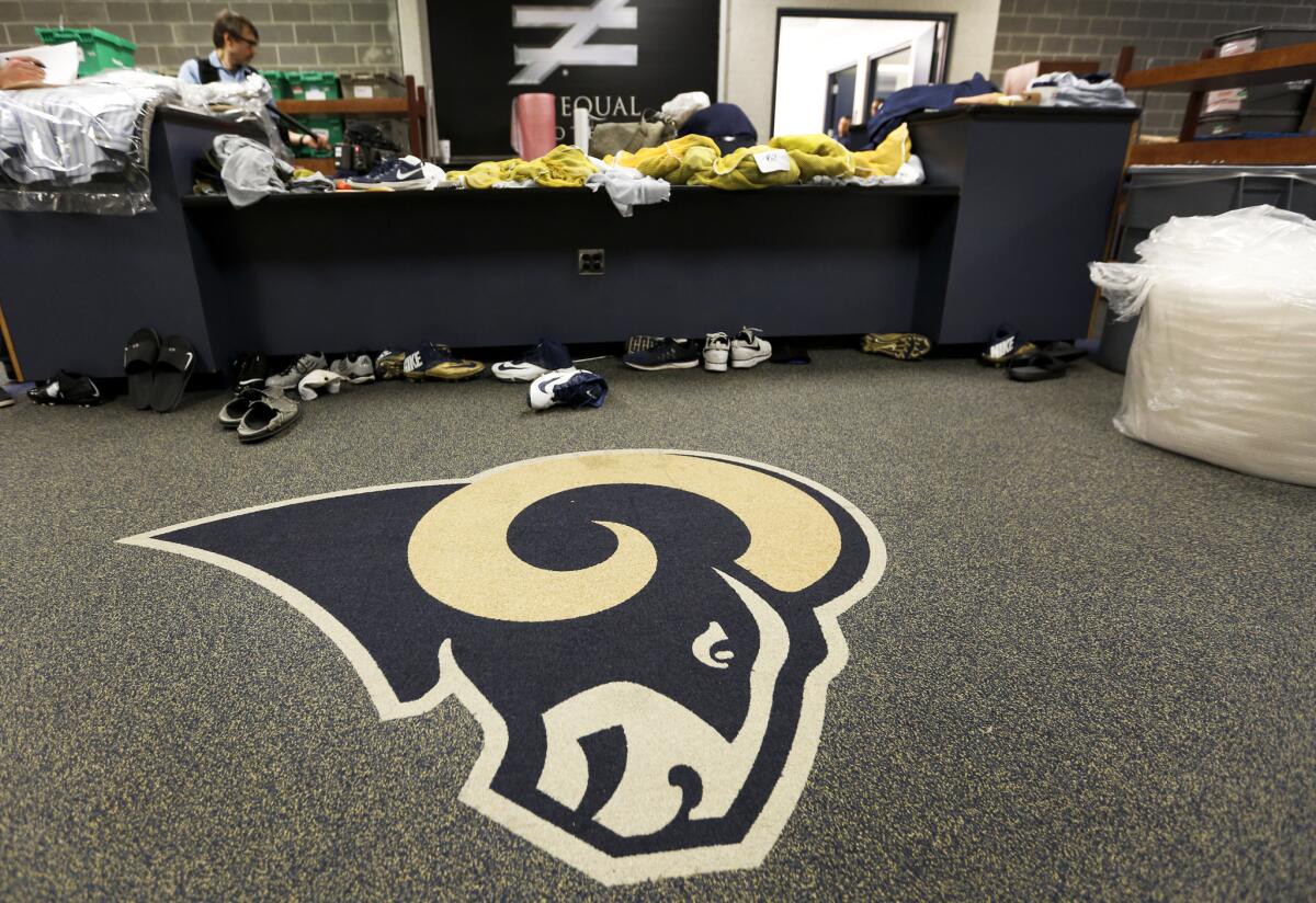 The Rams locker room in St. Louis being emptied on March 22 while packing boxes and moving vans were being loaded with equipment, office furniture and football gear for the team's move to Los Angeles.