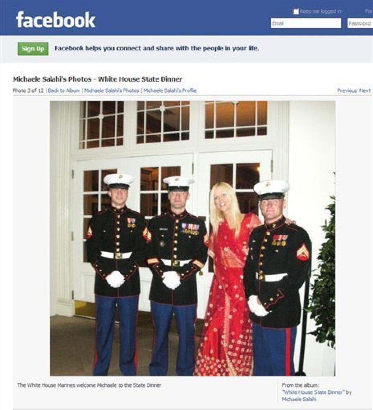 This screen image made from Michaele Salahi's Facebook page shows a photo of Michaele Salahi, second right, with three Marines during arrivals at the White House state dinner in Washington on Tuesday Nov. 24, 2009. The Secret Service is looking into its own security procedures after determining that a Virginia couple, Michaele and Tareq Salahi, managed to slip into Tuesday night's state dinner at the White House even though they were not on the guest list, agency spokesman Ed Donovan said. (AP Photo) NO SALES