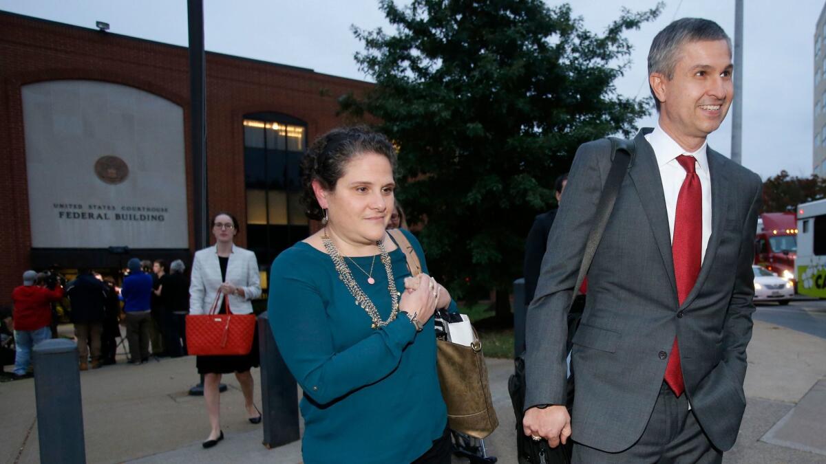 University of Virginia administrator Nicole Eramo, center, leaves federal court with her attorney, Tom Clare, after closing arguments Tuesday.