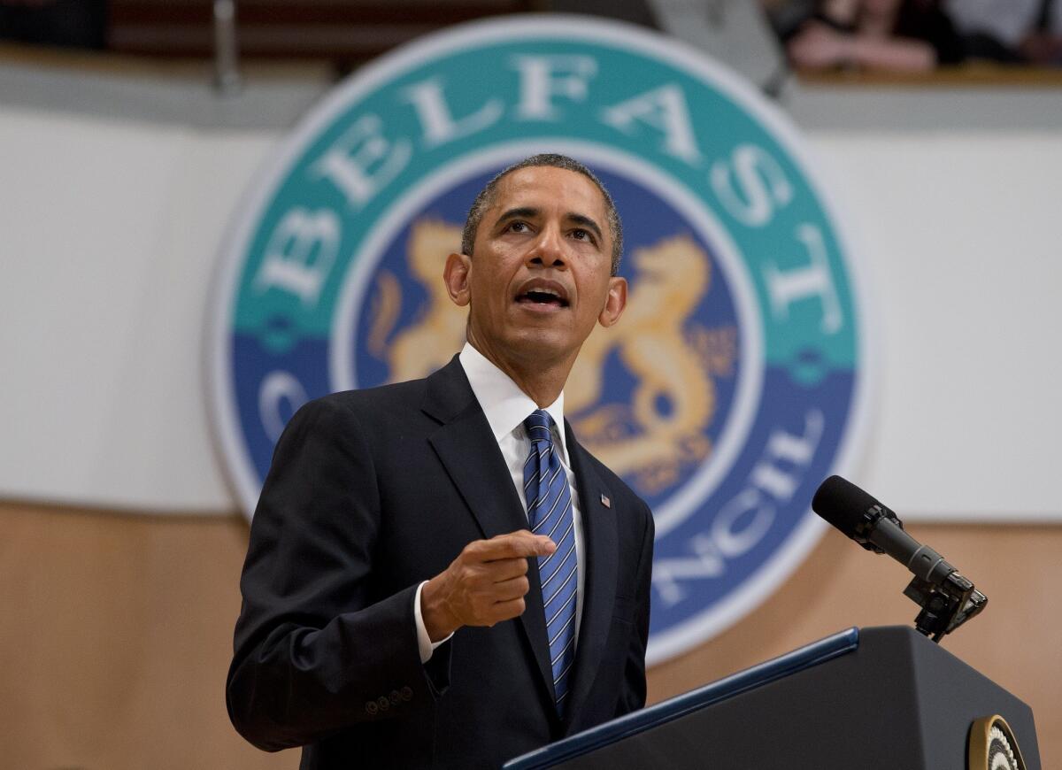 President Obama gestures during a speech at Belfast Waterfront Hall in Northern Ireland.