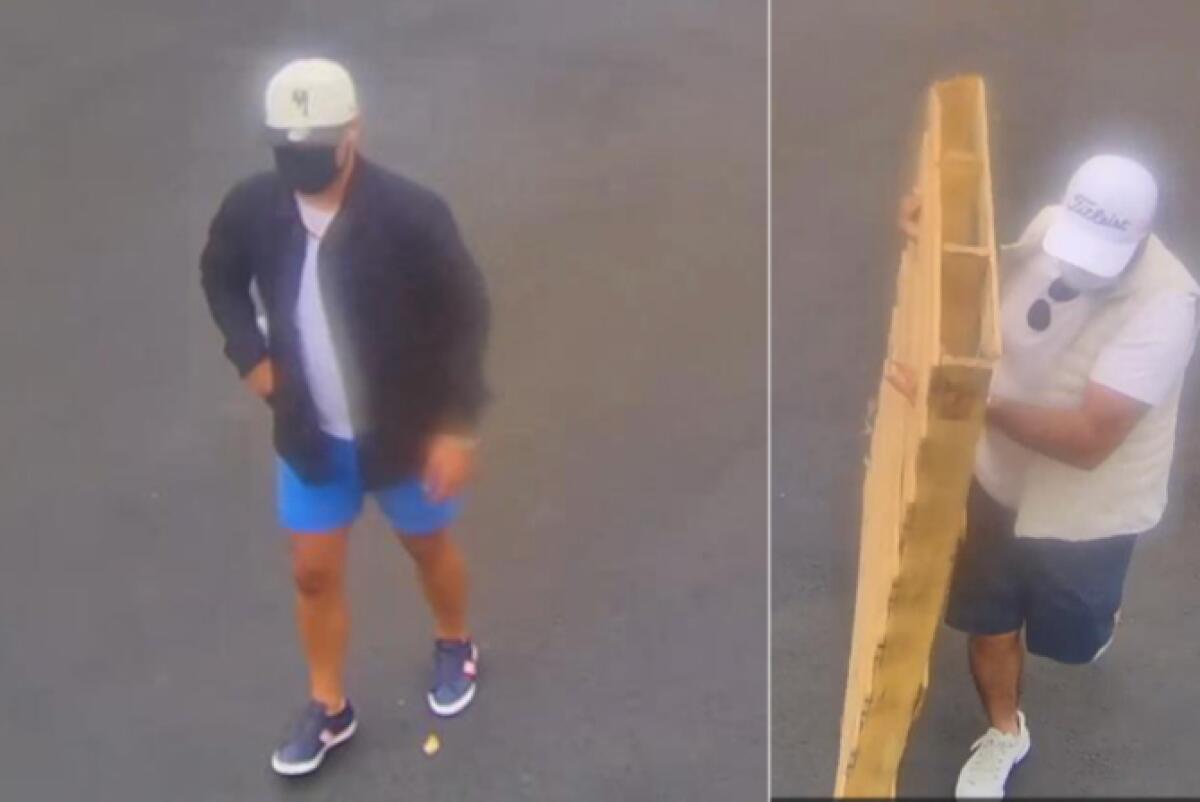 Men in caps and surgical masks on the city streets, one of them with a pallet