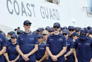 Members of the U.S. Coast Guard from U.S. Coast Guard cutter James await the arrival of U.S. Attorney General Pam Bondi and FBI Director Kash Patel for a news conference on Wednesday, April 9, 2025, at Port Everglades, Fla. (Amy Beth Bennett /South Florida Sun-Sentinel via AP)