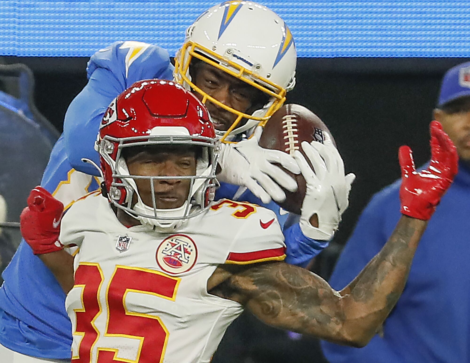 Chargers wide receiver Mike Williams, top, battles Kansas City Chiefs cornerback Charvarius Ward for a pass.