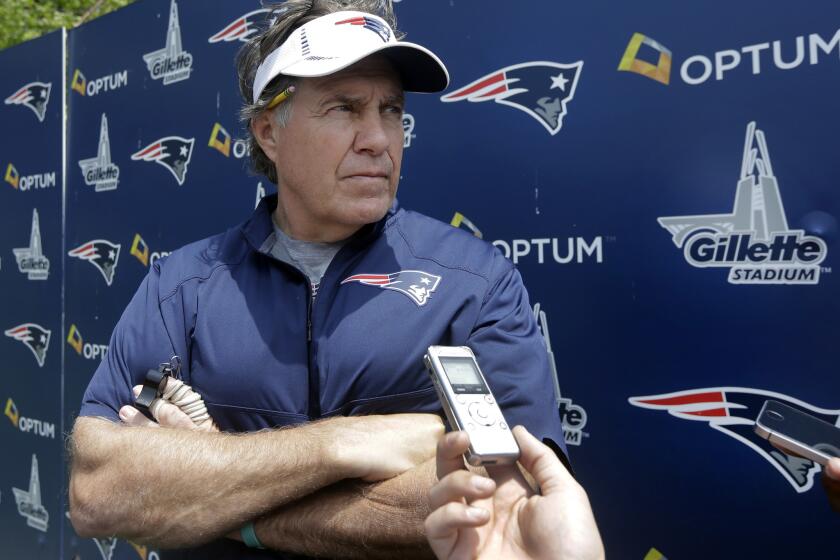 New England Coach Bill Belichick speaks to reporters after an organized team activity on June 11.
