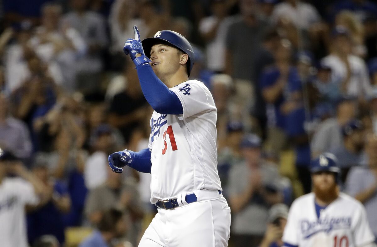 Dodgers' Joc Pederson celebrates his two-run home run against the Colorado Rockies during the fourth inning on Wednesday at Dodger Stadium.
