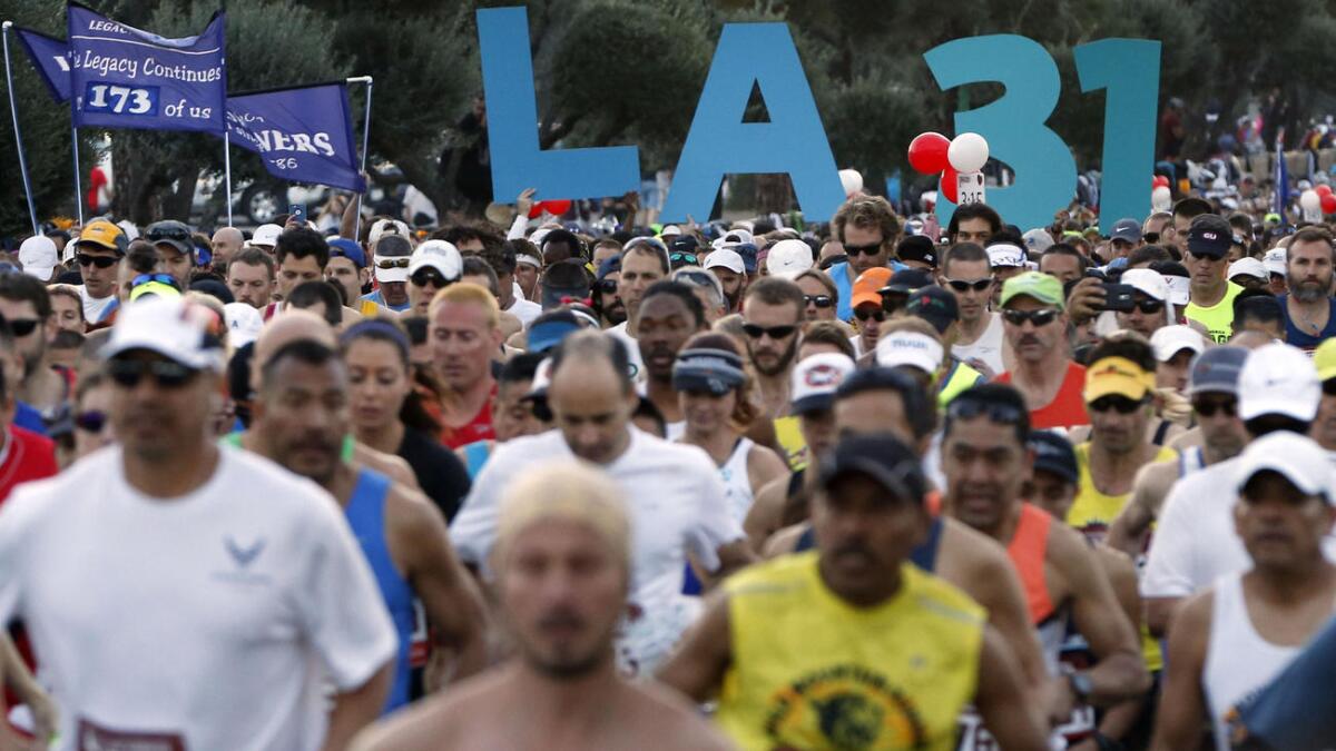 Runners cross the starting line at Dodger Stadium