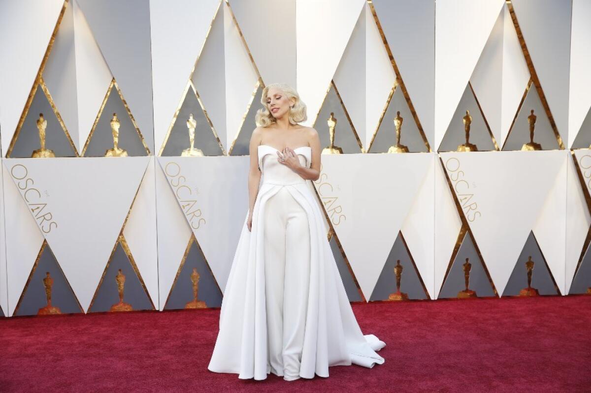 Lady Gaga wears a white pantsuit by Brandon Maxwell to the 88th Academy Awards in February.
