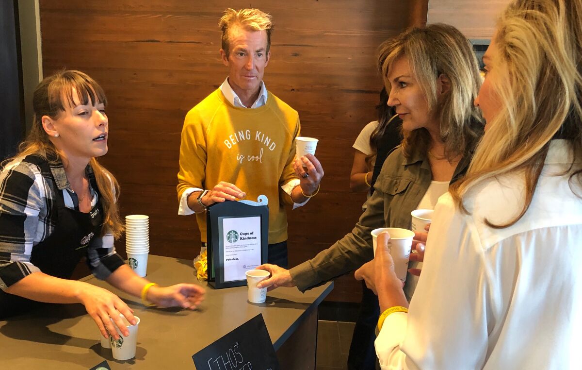(From right) Solana Beach City Councilwomen Kristi Becker and Kelly Harless, as well as Jonathon Collopy, who approached Starbucks with the "Cups of Kindness" idea, attended the initiative's kickoff on Sept. 18.