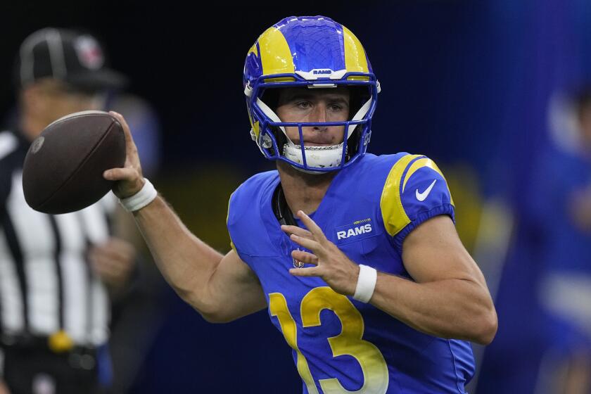 Los Angeles Rams quarterback Stetson Bennett throws during the first half.