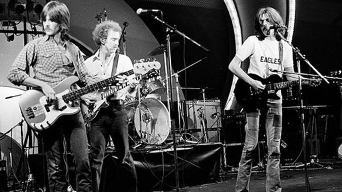 The Eagles, from left, bassist Randy Meisner, guitarist Bernie Leadon and guitarist Glenn Frey (drummer Don Henley is not visible), played their first show together in 1971 at Disneyland, backing Linda Ronstadt.