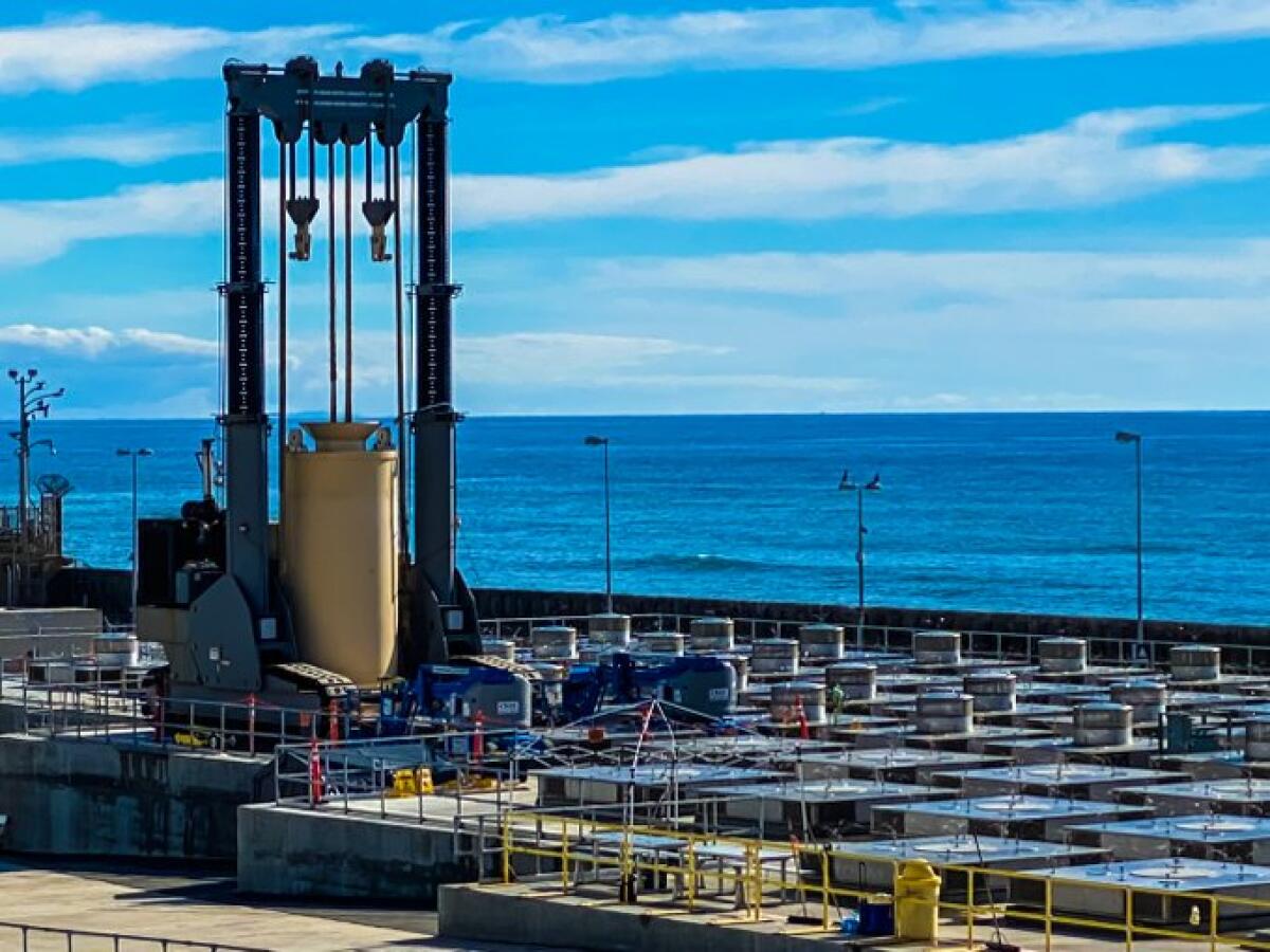 A specialized crane downloading a canister filled with used-up nuclear fuel at the San Onofre Nuclear Generating Station.
