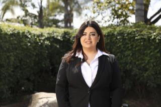 Jolyana Jirjees, who was recently promoted as the new executive director of the Chaldean Community Council stands outside of the Chaldean Community Council on Friday in El Cajon. (Photo by Sandy Huffaker for The SD Union-Tribune)