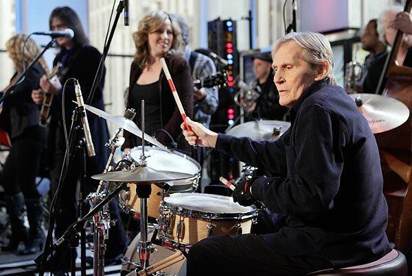 Levon Helm, right, performs with his band on the "Imus in the Morning" program on the Fox Business Channel in New York.