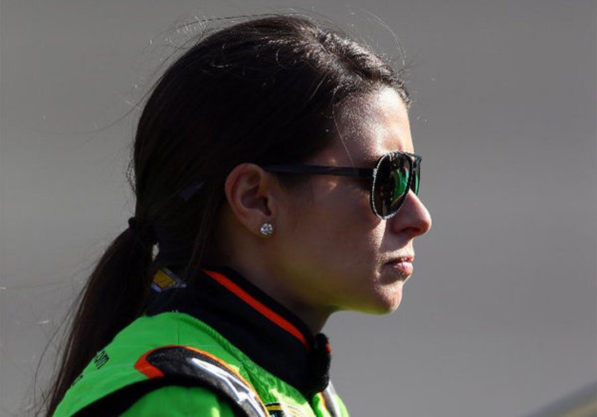 Danica Patrick stands on the grid during qualifying at Auto Club Speedway in Fontana.