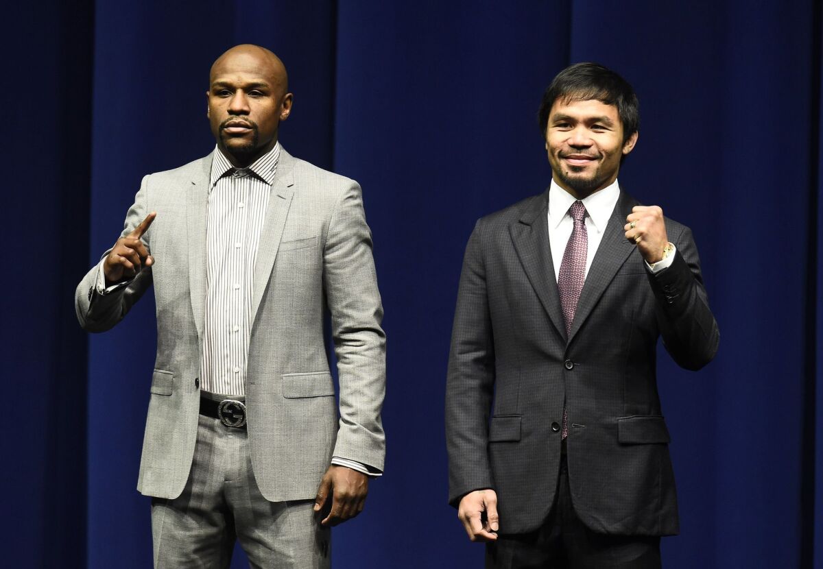Floyd Mayweather Jr. and Manny Pacquiao take part in a news conference at the Nokia Theatre at L.A. Live on March 11.