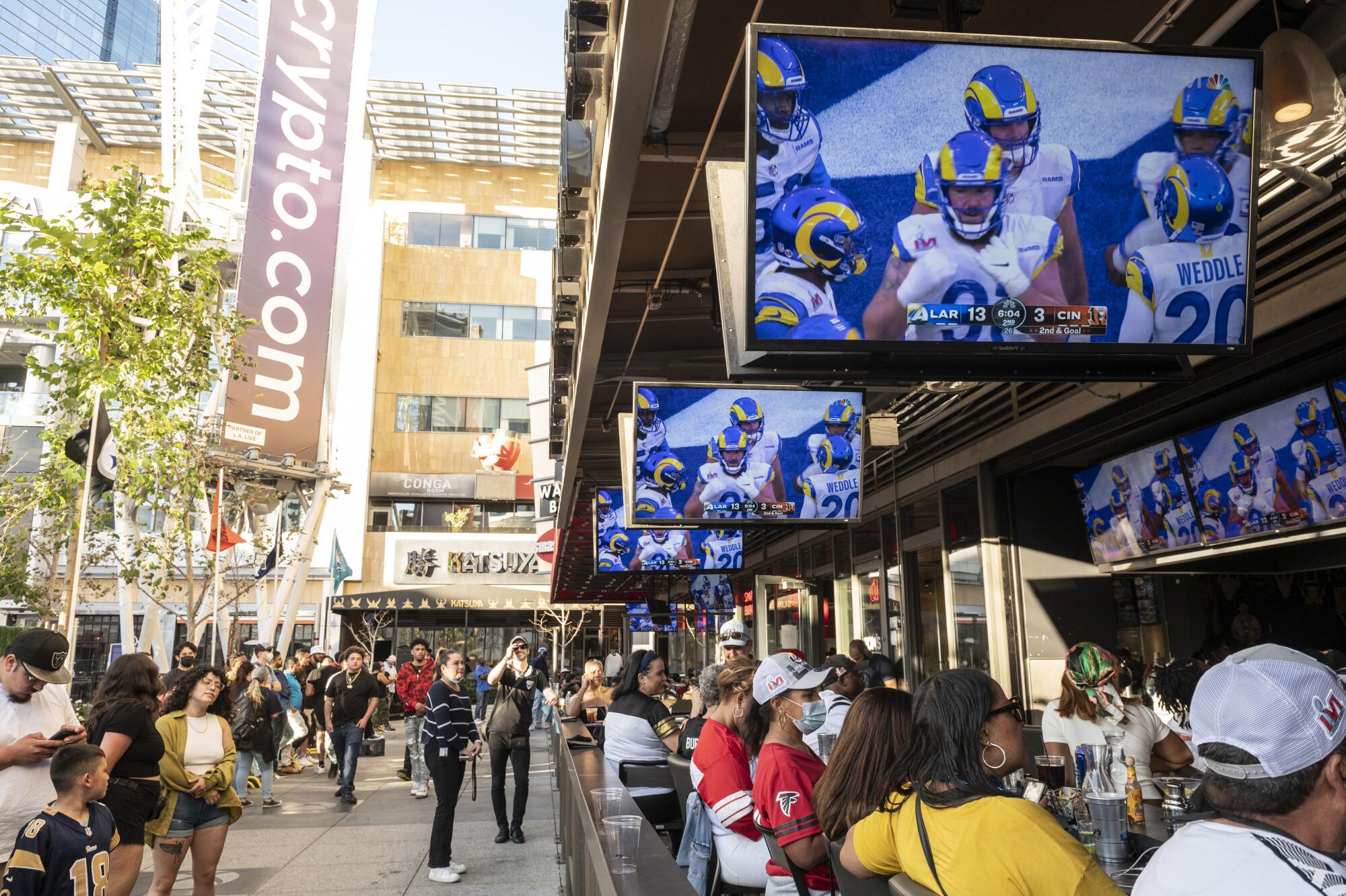 Spectators watch the Rams and Bengals play during the Super Bowl at Tom's Watch Bar at L.A. Live in Downtown Los Angeles.