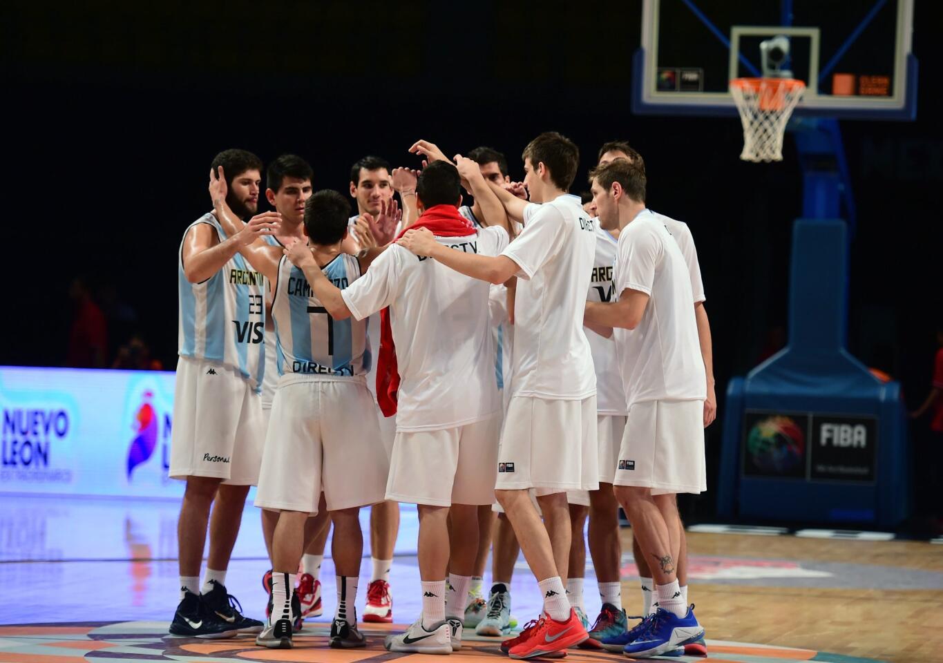 Argentina's players celebrate their victory over Dominican Republic, during a 2015 FIBA Americas Championship Men's Olympic qualifying match at the Sport Palace in Mexico City on September 8, 2015. AFP PHOTO/RONALDO SCHEMIDTRONALDO SCHEMIDT/AFP/Getty Images ** OUTS - ELSENT, FPG - OUTS * NM, PH, VA if sourced by CT, LA or MoD **