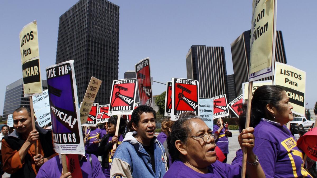 Union janitors and supporters rally in Century City in 2012 over wages and affordable healthcare.