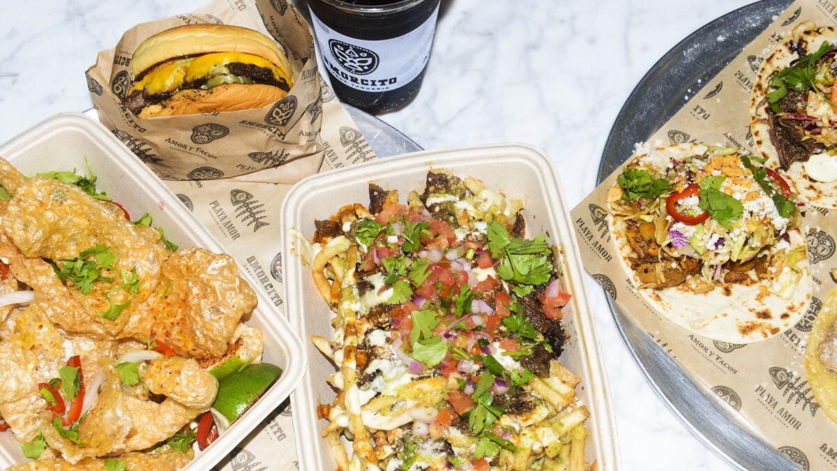 Chicharrónes, from left, green chile cheeseburger, salsa verde y queso fries and a taco plate from Amorcito, chef Thomas Ortega's new fast-casual Mexican restaurant at the Long Beach Exchange.