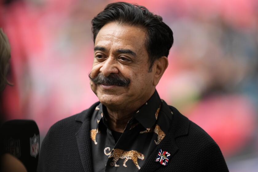 Jacksonville Jaguars owner Shahid Khan is interviewed before an NFL football game between the Atlanta Falcons and the Jacksonville Jaguars at Wembley stadium in London, Sunday, Oct. 1, 2023. (AP Photo/Kirsty Wigglesworth)