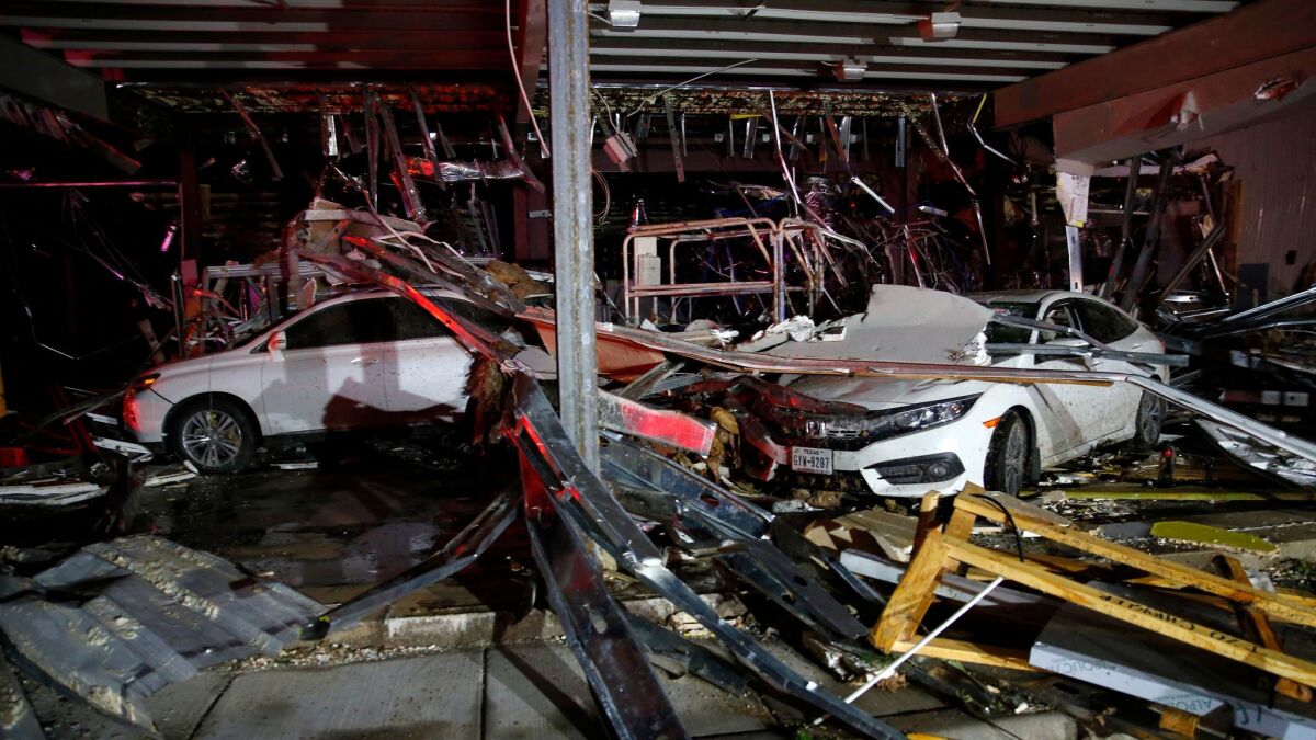 A Dodge dealership near Canton, Texas, is in ruins after a tornado blew out its walls.