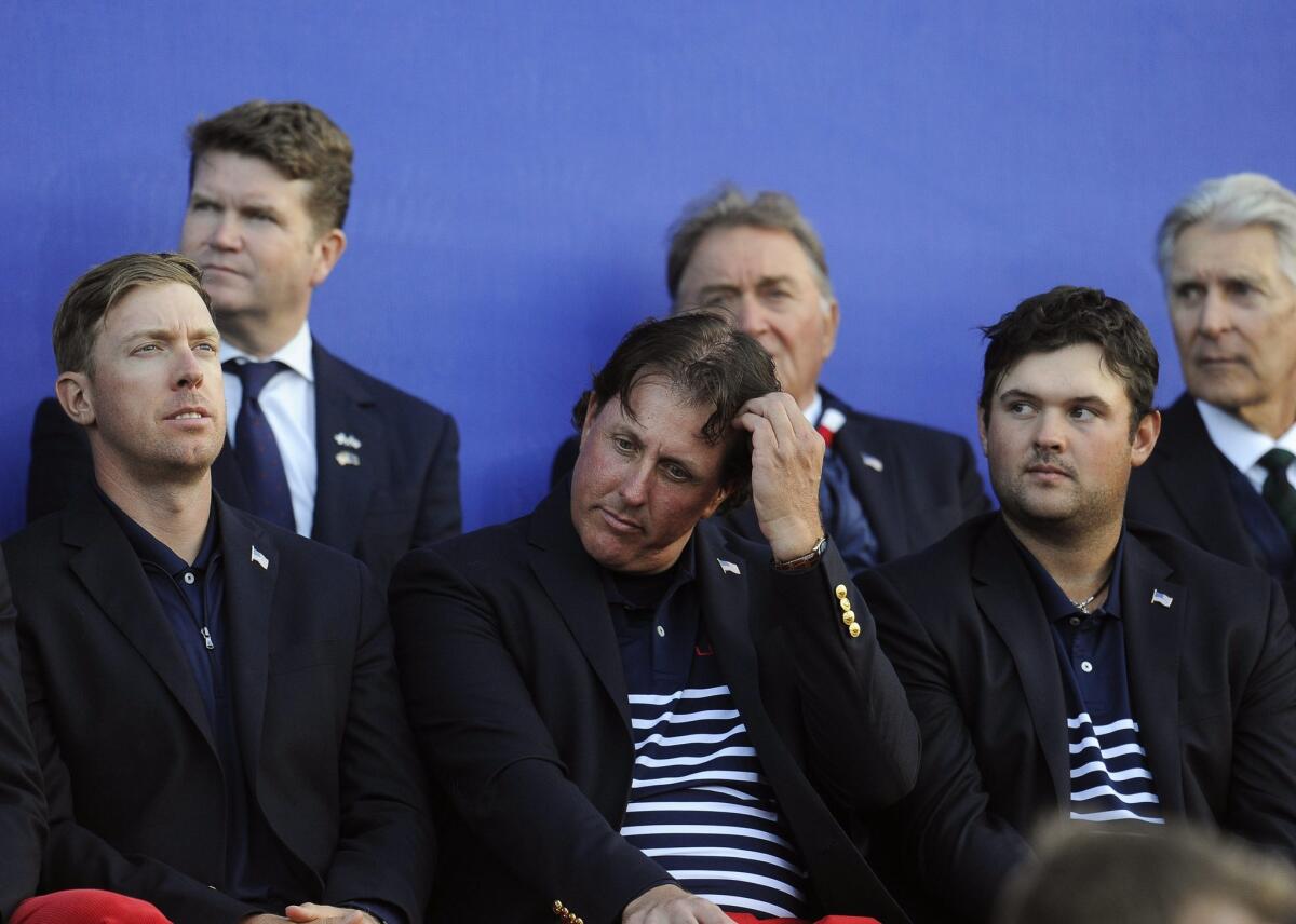 Phil Mickelson, center, and his U.S. teammates react after losing the Ryder Cup against Europe for the eighth time in the last 10 years last month at Gleneagles, Scotland.