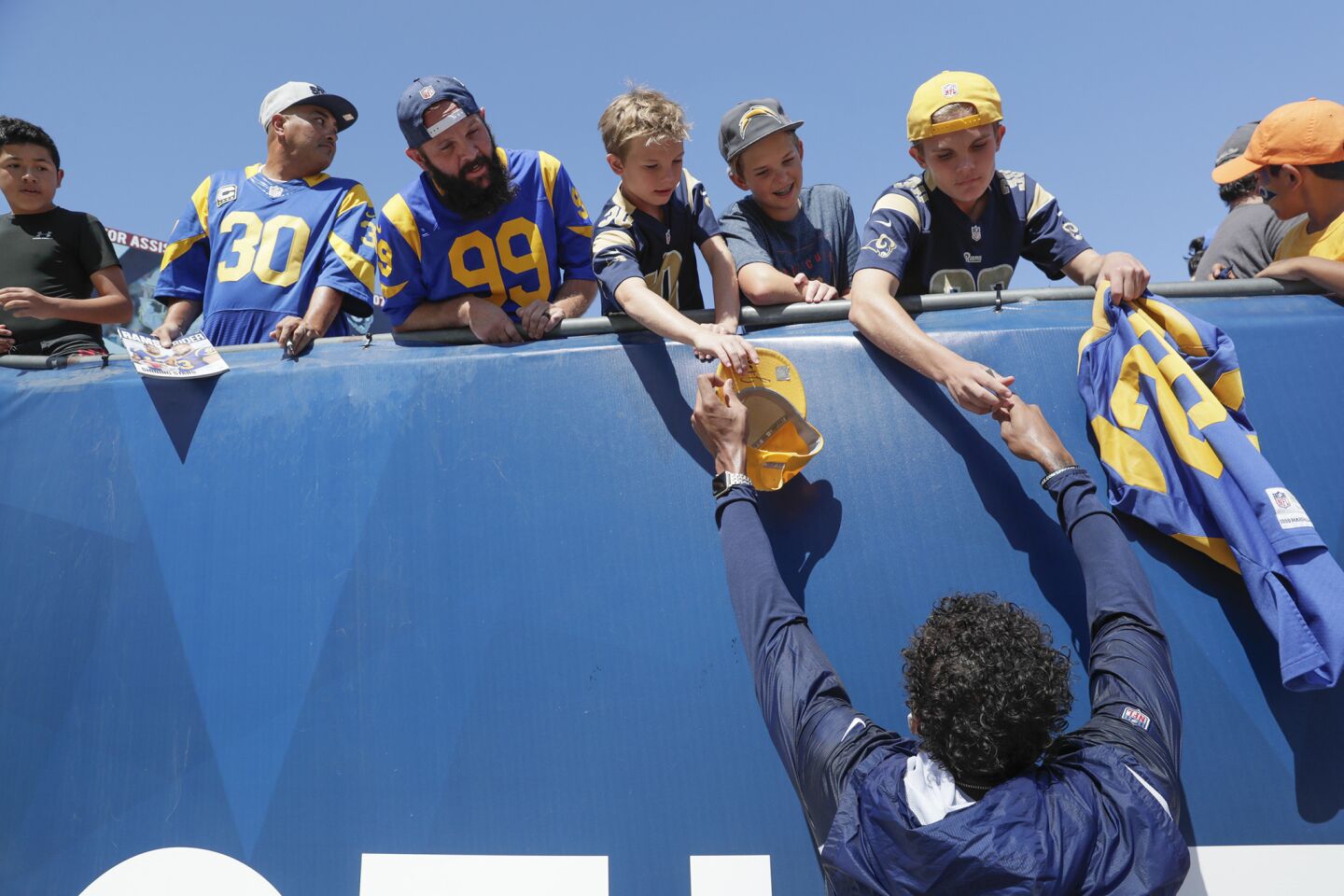 LOS ANGELES, CA, SUNDAY, SEPTEMBER 23, 2018 - Fans reach for an autograph from Rams receiver Josh Reynolds before a game against the Chargers at the Coliseum.