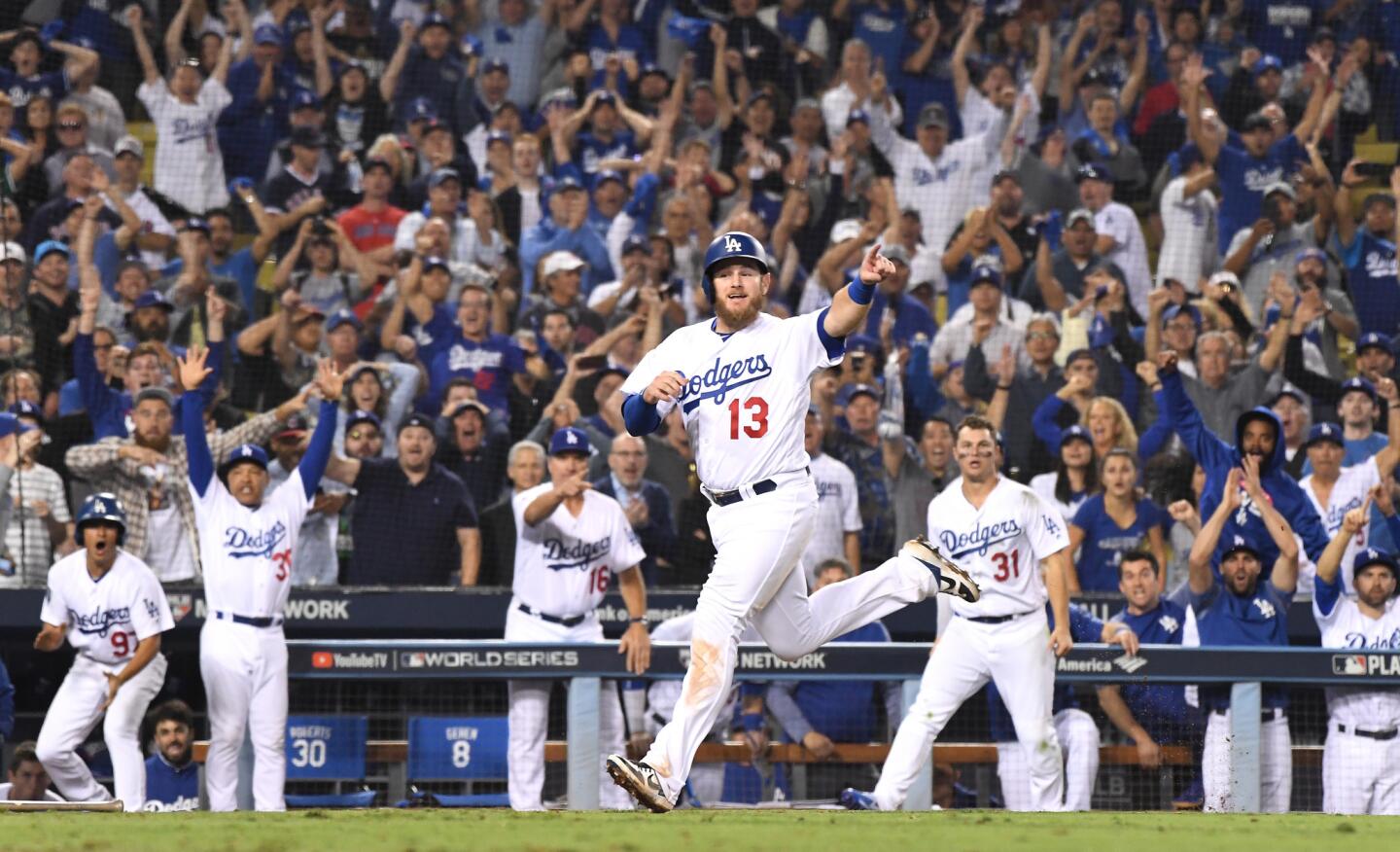 Dodgers Max Muncy scores the tying run on an error by the Red Sox in the 13th inning.