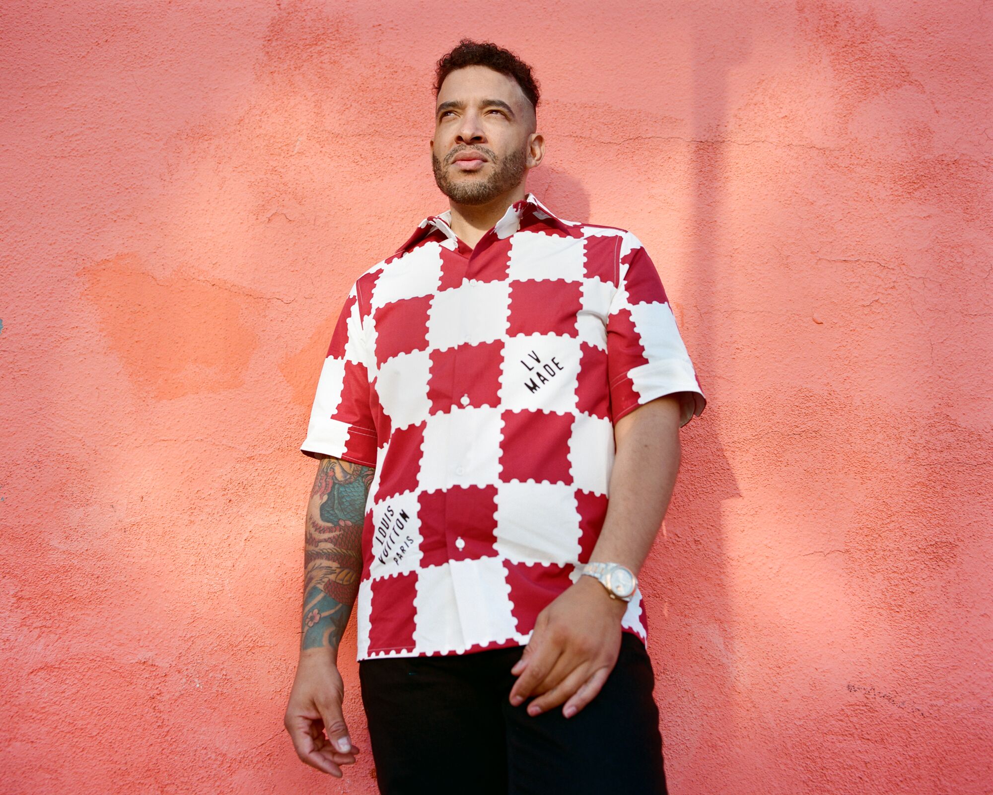 A man in a red and white checked shirt