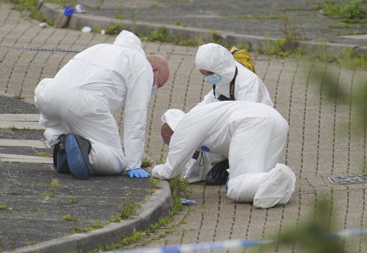 Forensic officers working at site of mass shooting