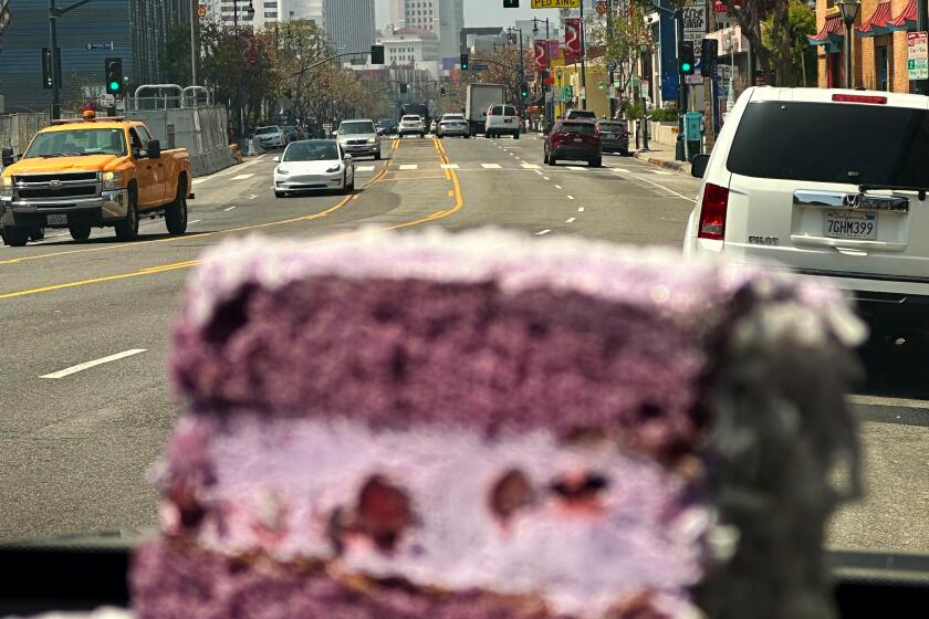 Los Angeles, California-June 8, 2024-1. Can you eat a piece of cake in your car without making a total mess? I'm about to find out. 2. The cake is gone, but the damage is done. (Shelby Grad/Los Angeles Times)
