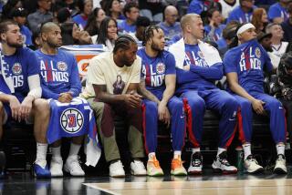 LA Clippers bench with Kawhi Leonard sitting out is despondent in their loss to the Phoenix Suns