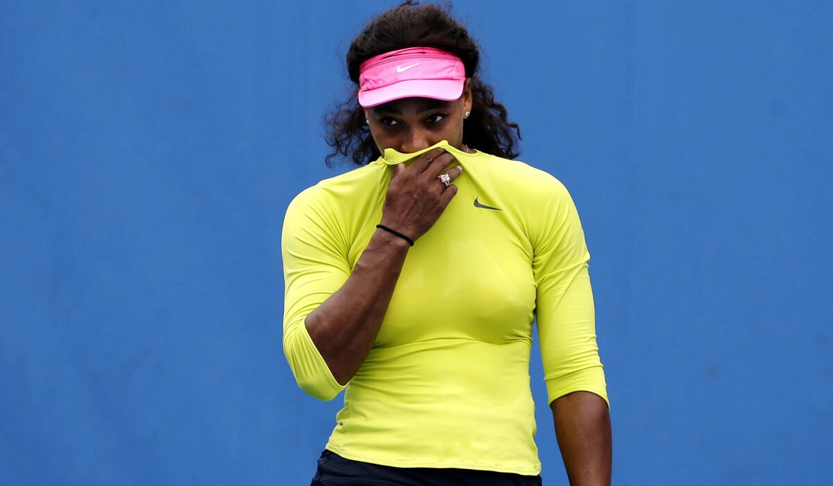 Serena Williams tries to stifle a cough during a practice session Saturday in Melbourne.