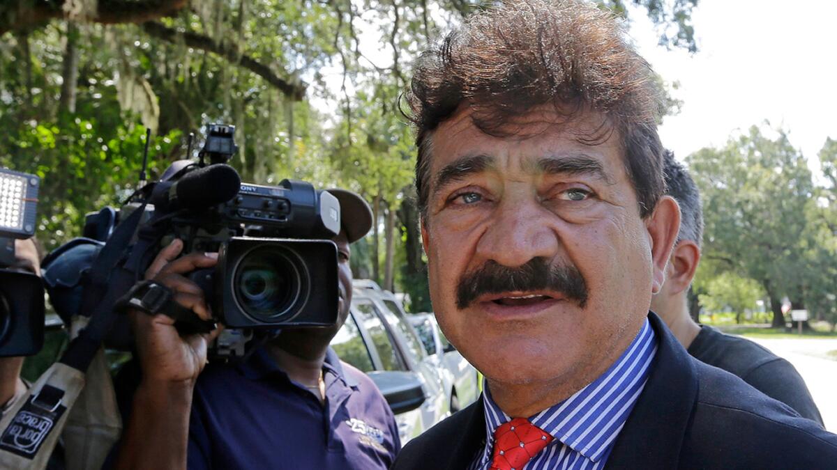 Seddique Mateen, father of Omar Mateen, talks with reporters across the street from a Fort Pierce, Fla., residence owned by the family.