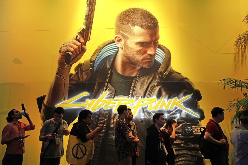 LOS ANGELES, CA -- JUNE 11, 2019: Attendees wait in line for a peek at "Cyberpunk 2077" from CD Projekt Red, which is scheduled for release in April 2020 (cq), during E3 at the Los Angeles Convention Center. (Myung J. Chun / Los Angeles Times)