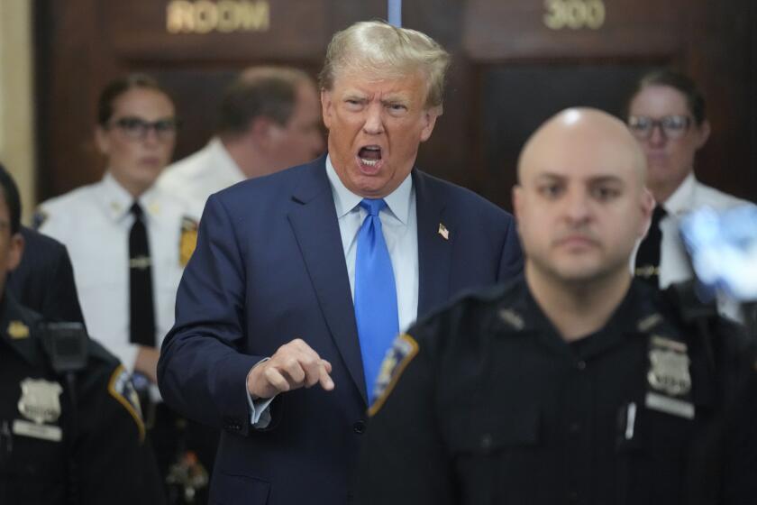 Former President Donald Trump speaks to reporters during a lunch break at New York Supreme Court in New York, Monday, Oct. 2, 2023. Trump is attending the start of a civil trial in a lawsuit that already has resulted in a judge ruling that he committed fraud in his business dealings. (AP Photo/Seth Wenig)