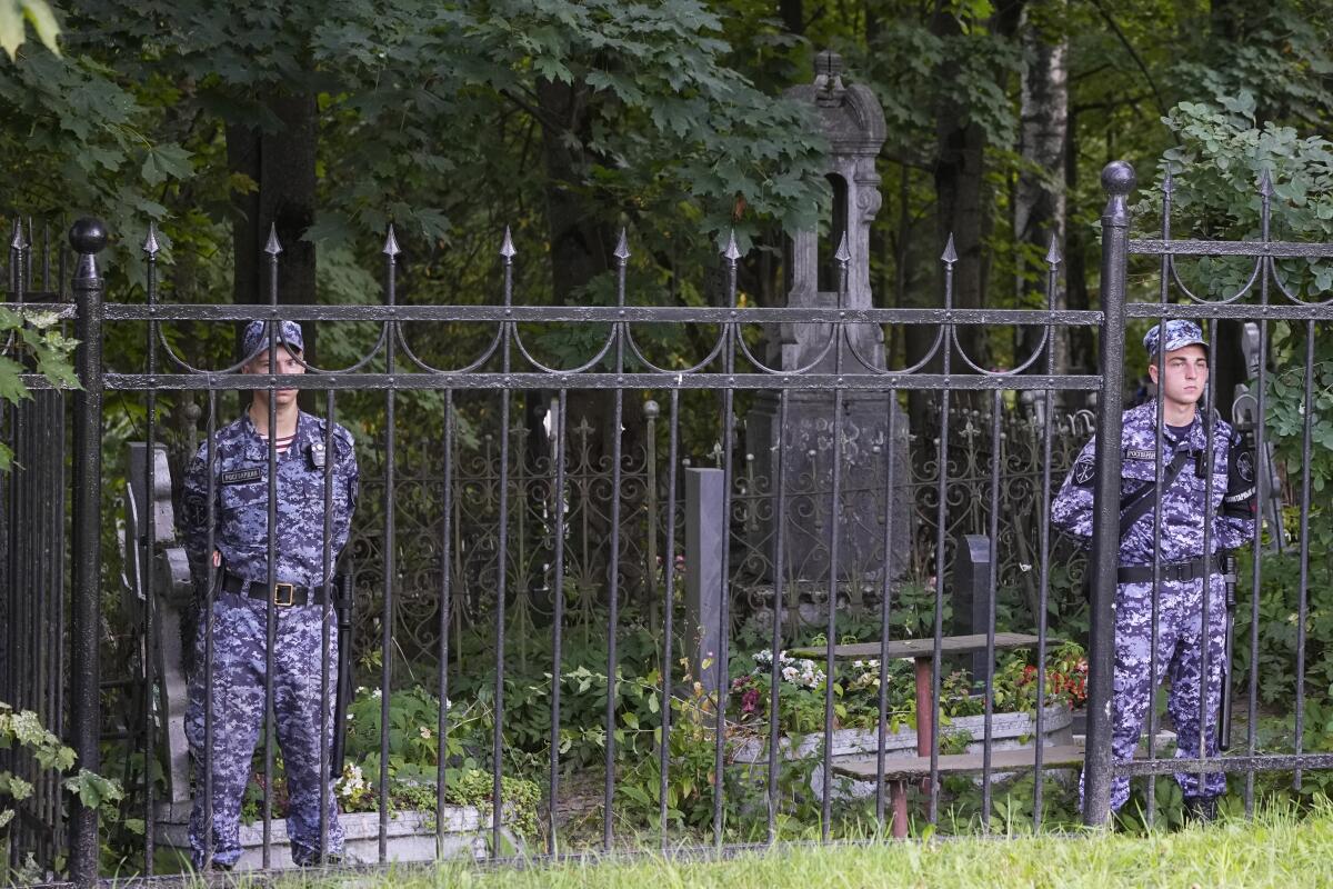 Russian Rosguardia (National Guard) servicemen guard the Porokhovskoye cemetery in St. Petersburg, Russia.