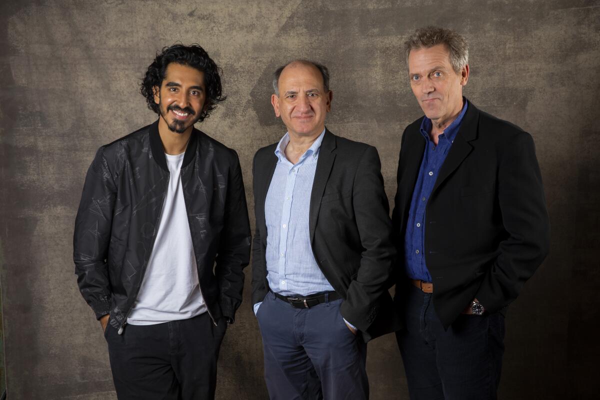 Dev Patel, director Armando Iannucci and Hugh Laurie.