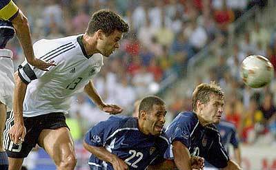 German striker Michael Ballack, left, scores on a header during the 2002 FIFA World Cup quarterfinal soccer match between Germany and USA in Ulsan, South Korea June 21.
