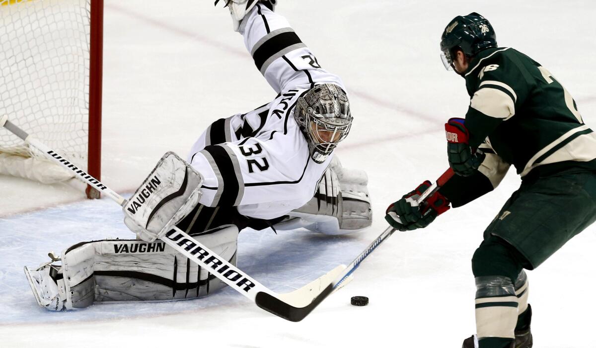 Kings goalie Jonathan Quick stops a shot on a breakaway attempt by Wild right wing Nino Niederreiter in the first period Saturday in St. Paul, Minn.