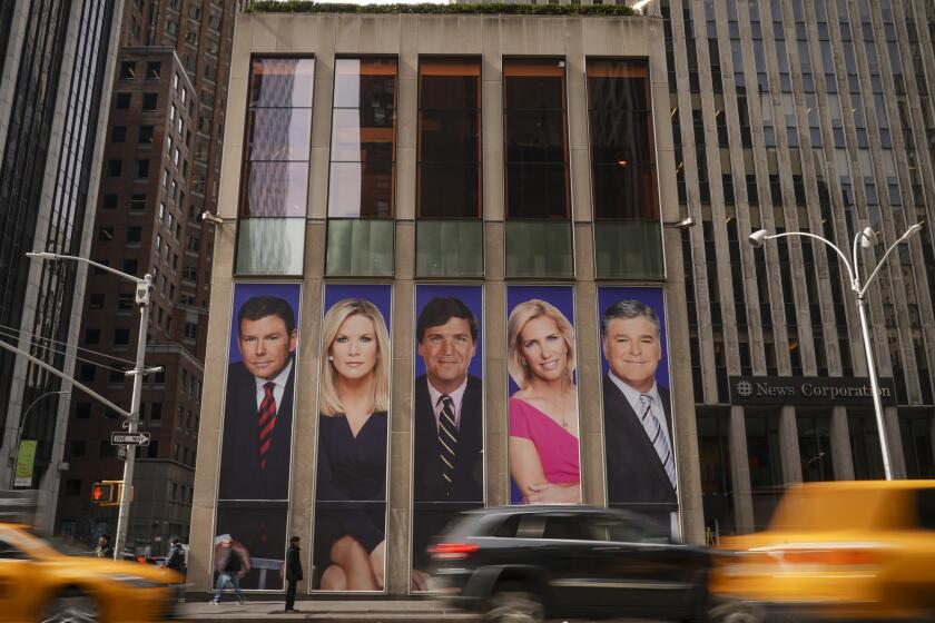 NEW YORK, NY - MARCH 13: Traffic on Sixth Avenue passes by advertisements featuring Fox News personalities, including Bret Baier, Martha MacCallum, Tucker Carlson, Laura Ingraham, and Sean Hannity, adorn the front of the News Corporation building, March 13, 2019 in New York City. On Wednesday the network's sales executives are hosting an event for advertisers to promote Fox News. Fox News personalities Tucker Carlson and Jeanine Pirro have come under criticism in recent weeks for controversial comments and multiple advertisers have pulled away from their shows. (Photo by Drew Angerer/Getty Images)