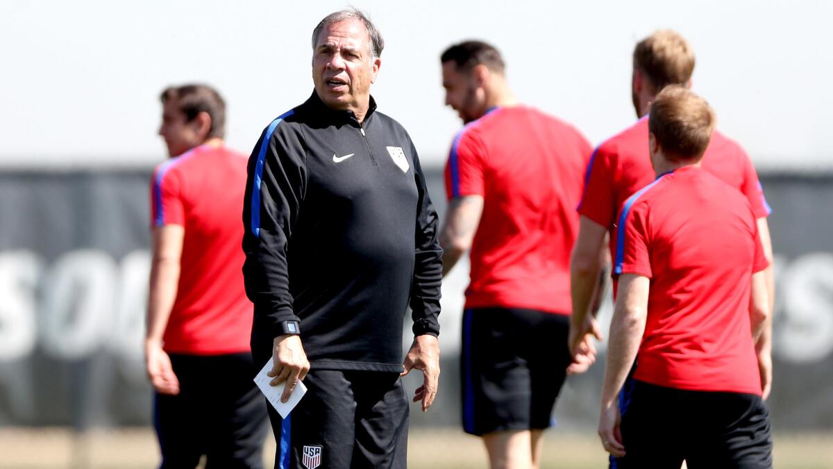 Bruce Arena takes the U.S. men's national team during its paces at training camp in Commerce City, Colo., in preparation for World Cup qualifiers.