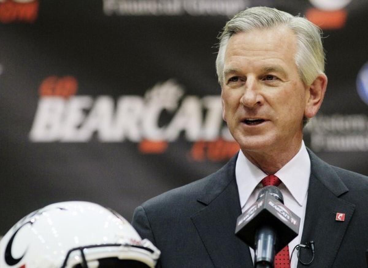 Tommy Tuberville is introduced as the new football coach at Cincinnati on Saturday.