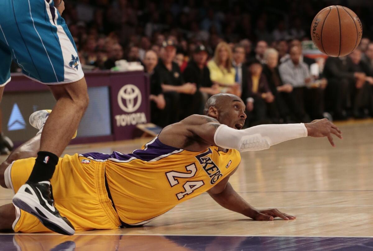 Lakers guard Kobe Bryant loses control of the ball as he slips in the second half.
