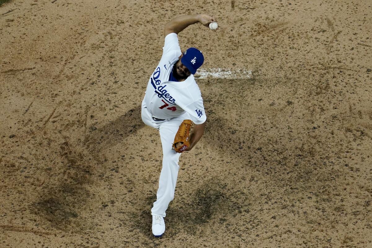 Dodgers relief pitcher Kenley Jansen throws against the Atlanta Braves during the ninth inning.