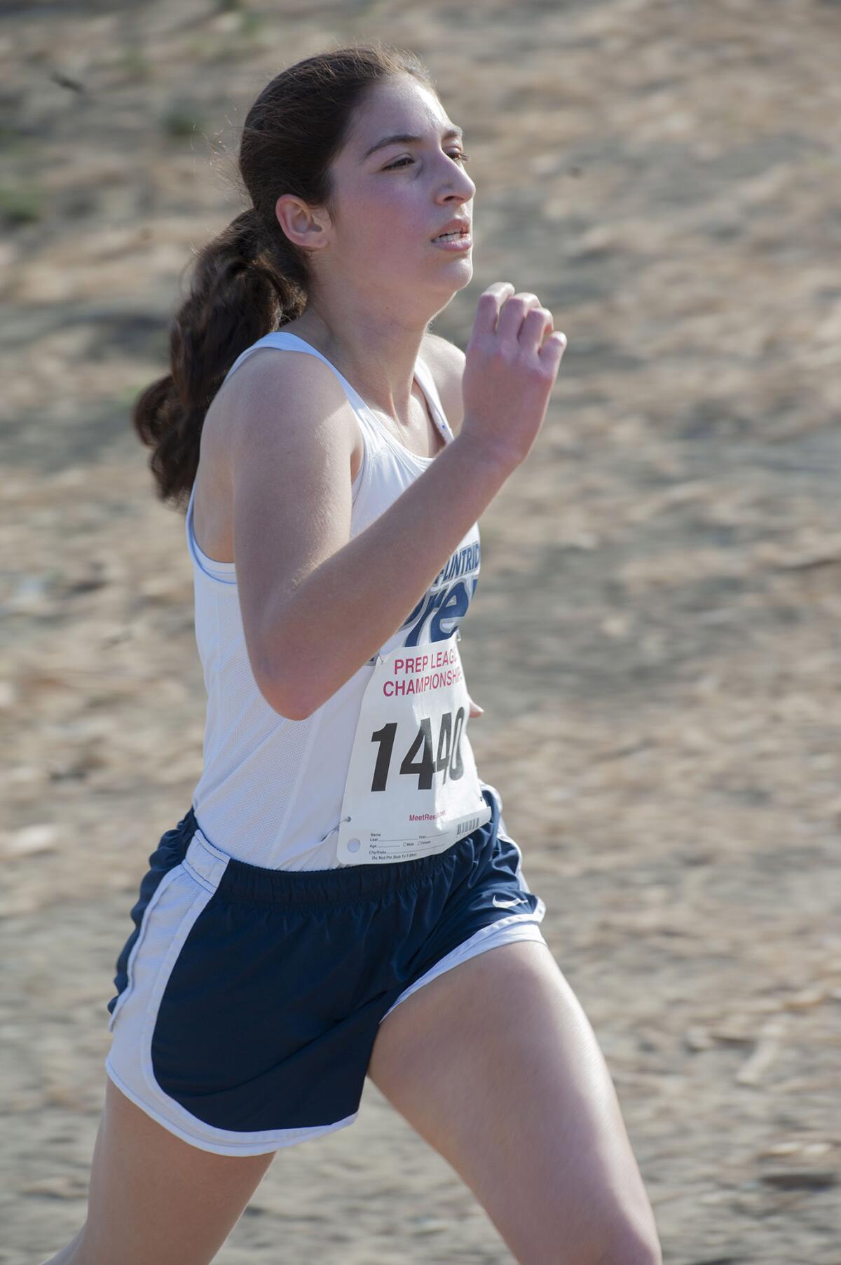 Flintridge Prep's Nicole Mirzaian approaches the finish line of the girls varsity Prep League Cross Country finals at Pierce College Saturday. (Photo by Miguel Vasconcellos)