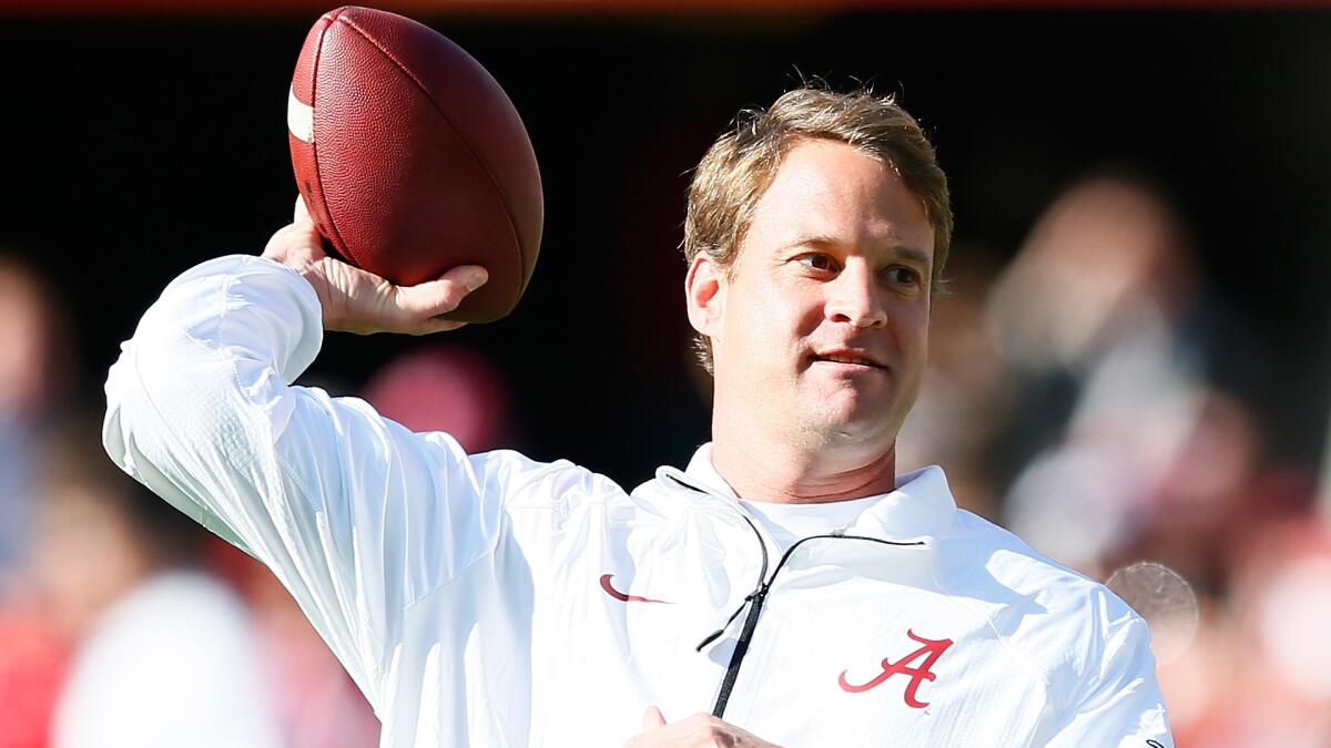 Alabama offensive coordinator and former USC coach Lane Kiffin throws a football before the Crimson Tide's game against Mississippi State on Nov. 15.
