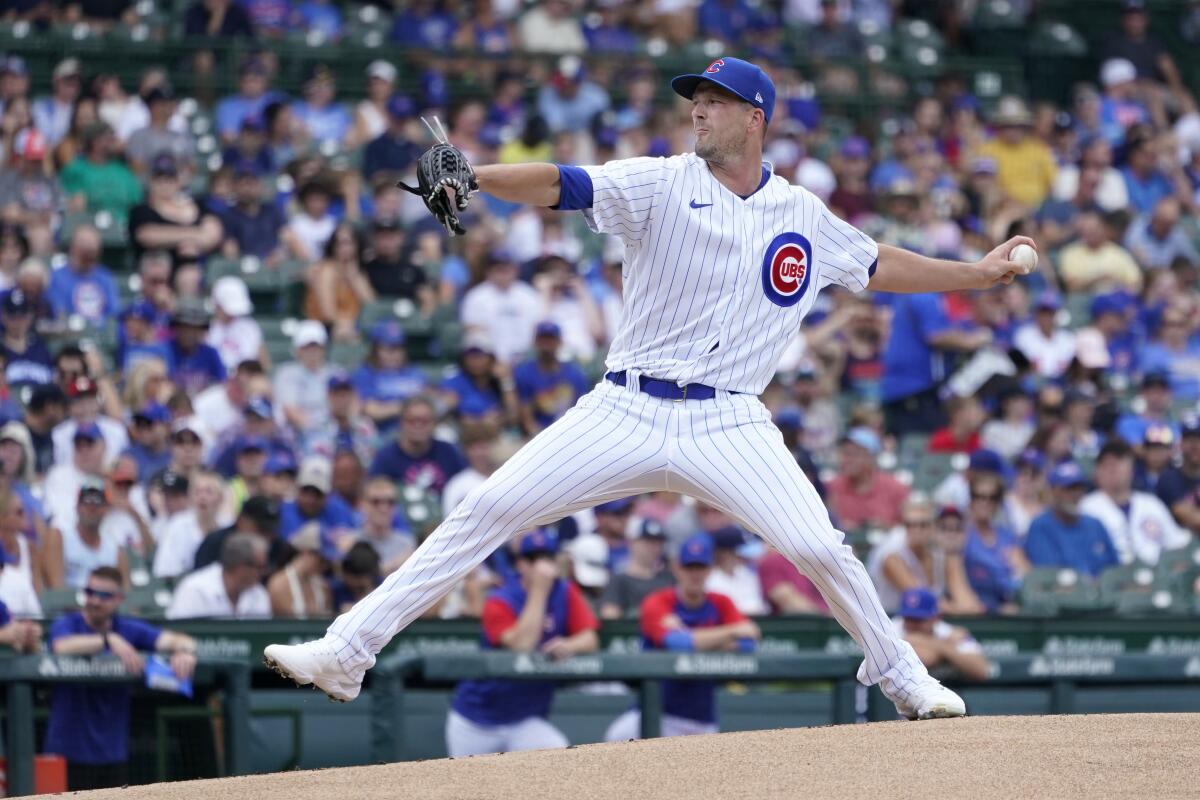 Chicago Cubs starting pitcher Drew Smyly winds up during the first inning of a baseball game against the Miami Marlins Saturday, Aug. 6, 2022, in Chicago. (AP Photo/Charles Rex Arbogast)